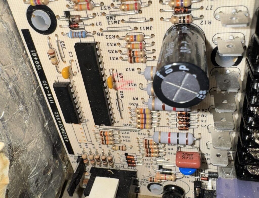 Furnace control board inspected during furnace repair service