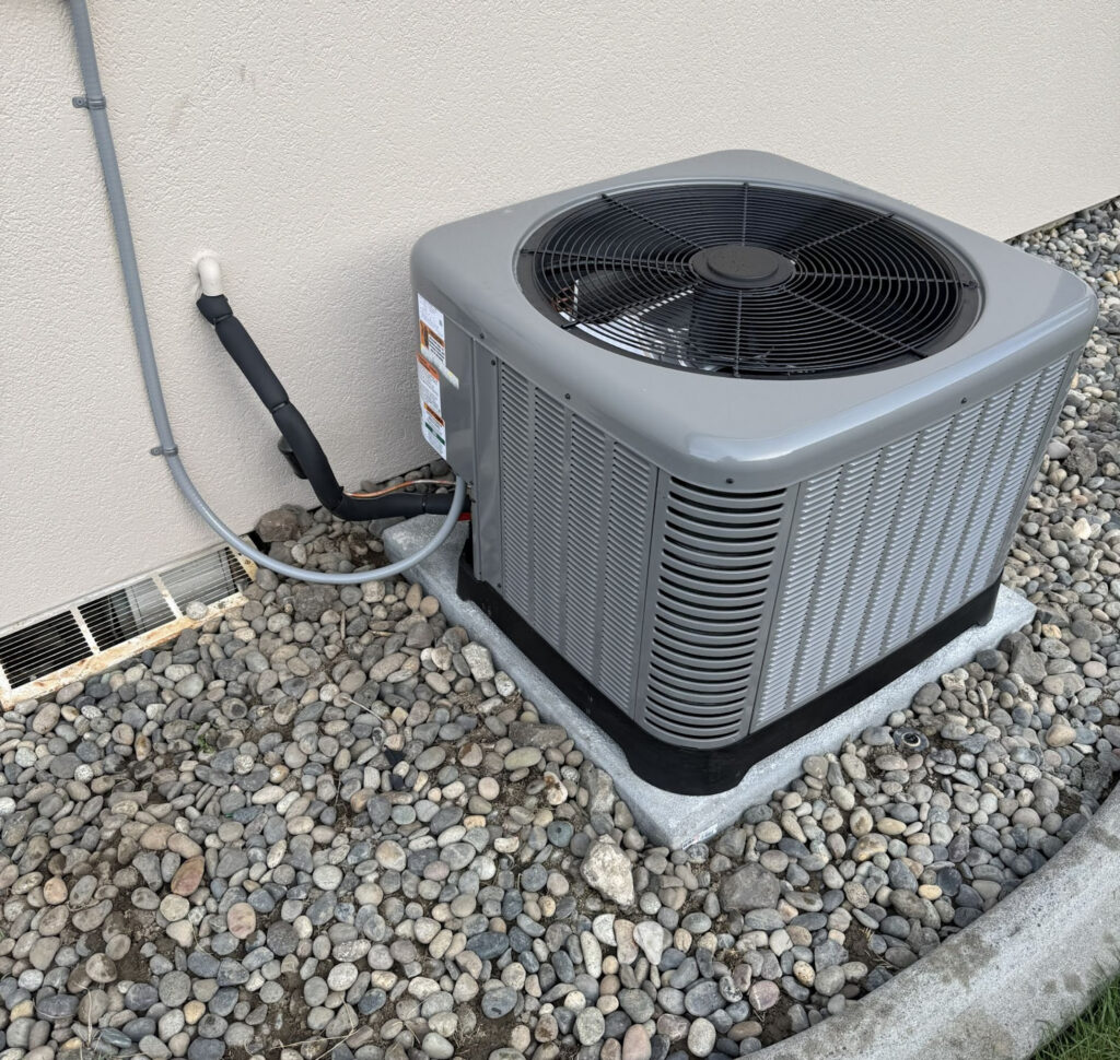 Residential air conditioning condenser unit during maintenance inspection