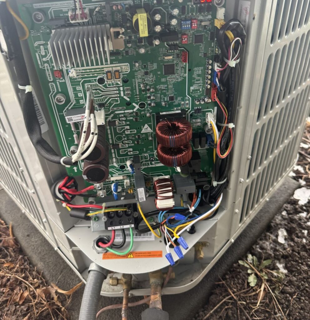 Close-up of HVAC circuit board during heating maintenance and system inspection