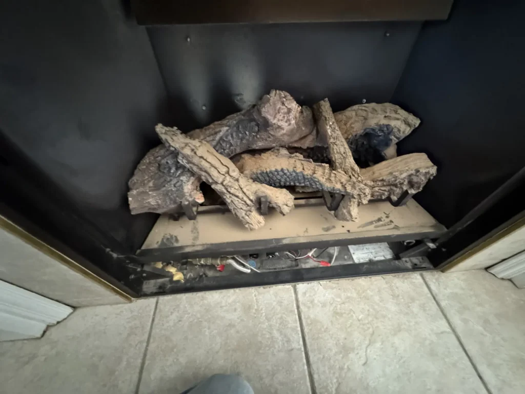 Interior components of a gas fireplace inspected during a professional repair and tune-up service